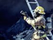 firefighter holding water hose